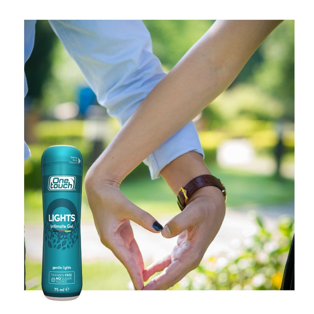 One Touch Lights product with a person outdoors making a heart shape with their hands.